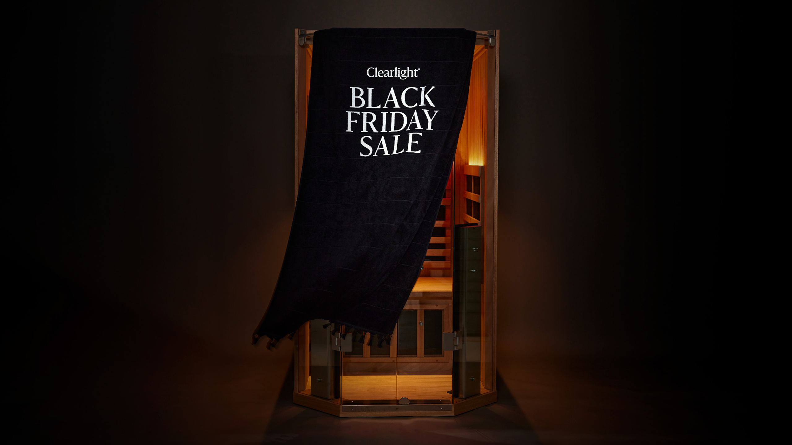 Sauna with a black cloth draped over it, displaying 'Clearlight Black Friday Sale' text.